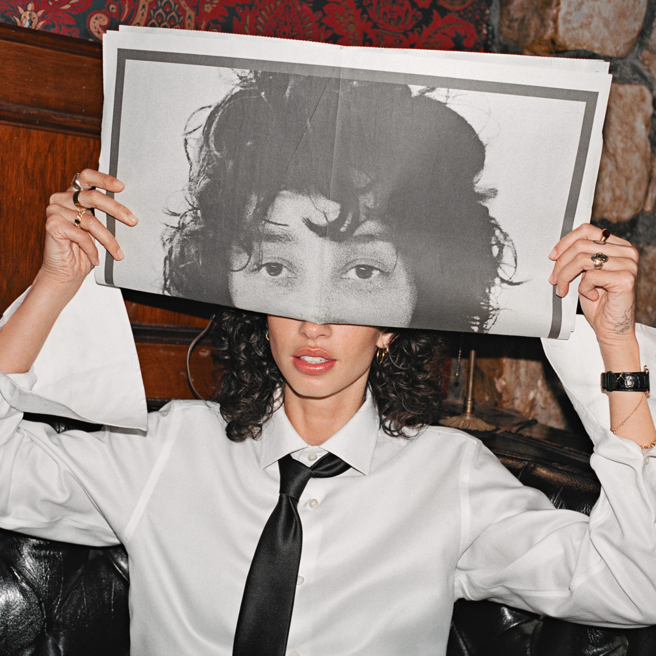 Towa Bird Dirty Habit single artwork featuring artist holding newspaper over face
