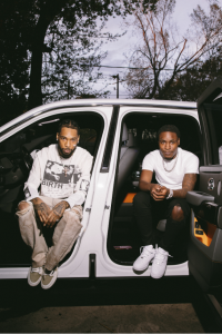 Mudbaby Ru and Key Glock sitting in SUV promoting Out The Mud single 2026