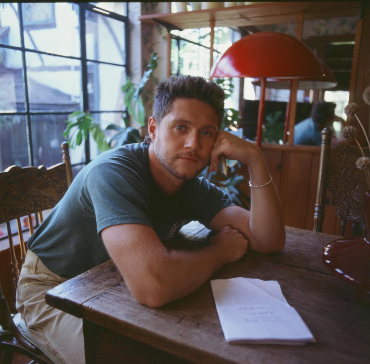 Niall Horan portrait at table photographed by Zackery Michael Dinner Party album era