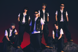 BE FIRST group photo 2026 members wearing black vests and sunglasses