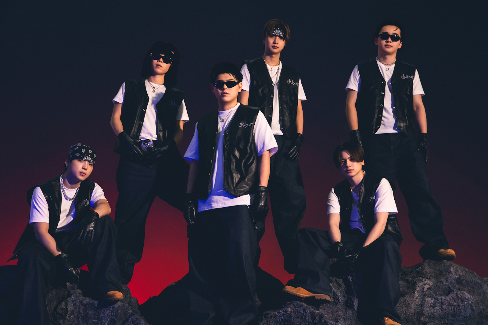 BE FIRST group photo 2026 members wearing black vests and sunglasses
