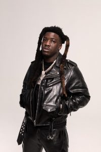 Hotboii portrait wearing black leather jacket promoting Outta Space single 2026