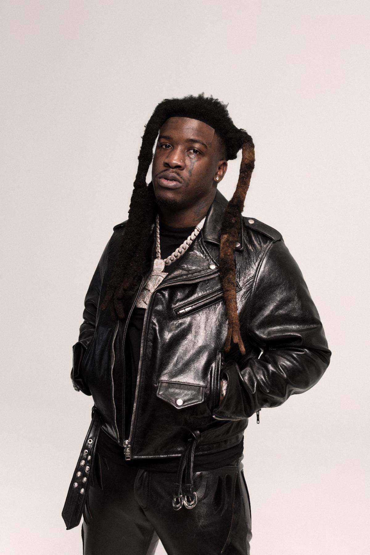 Hotboii portrait wearing black leather jacket promoting Outta Space single 2026