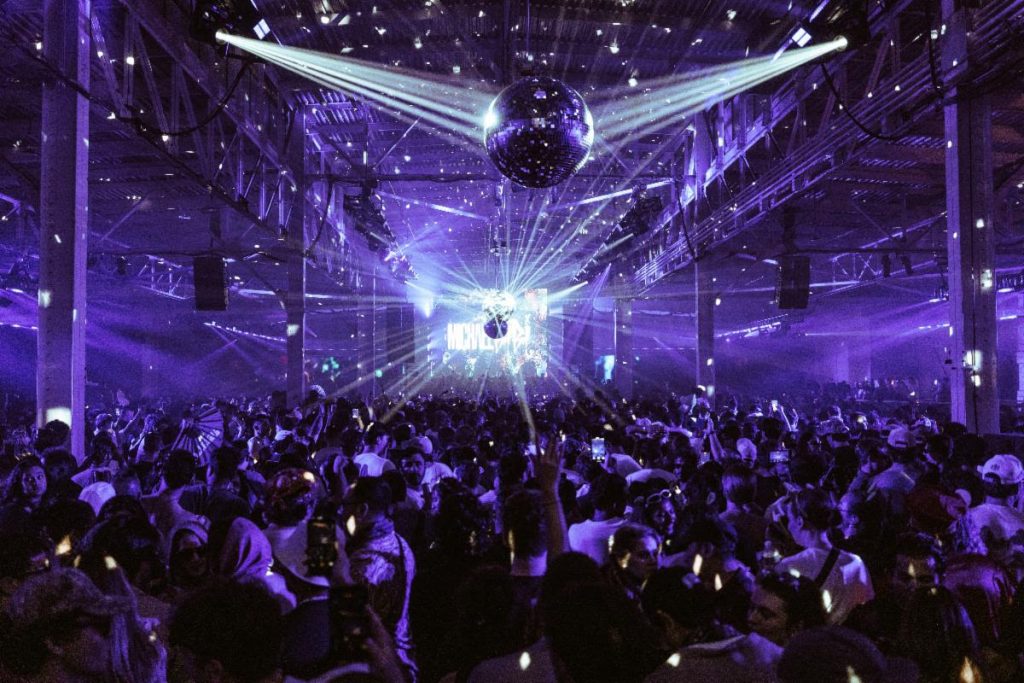Club Darc crowd inside Pier 48 warehouse San Francisco electronic music event dancefloor lighting