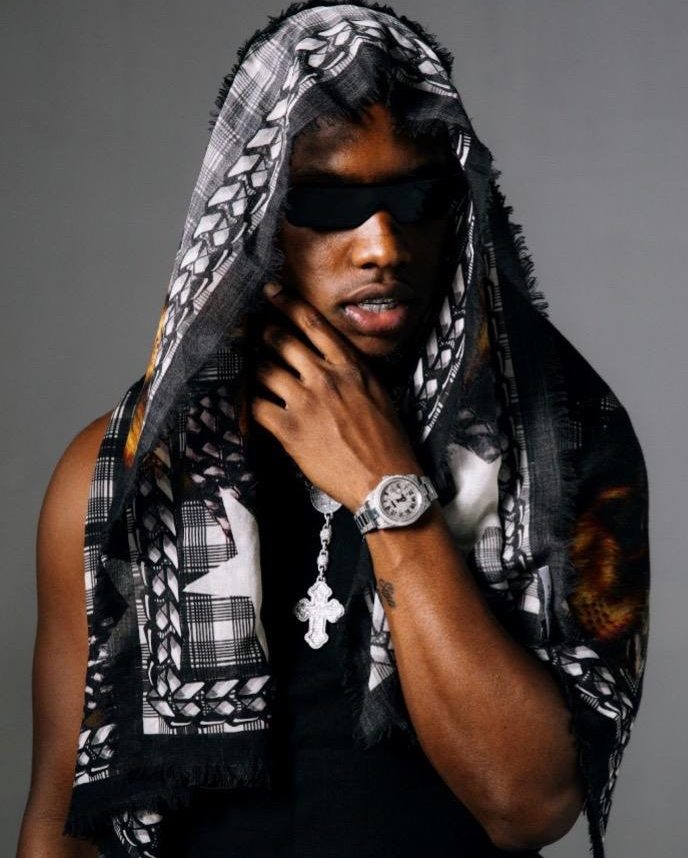 Rob49 portrait rapper New Orleans artist chain sunglasses