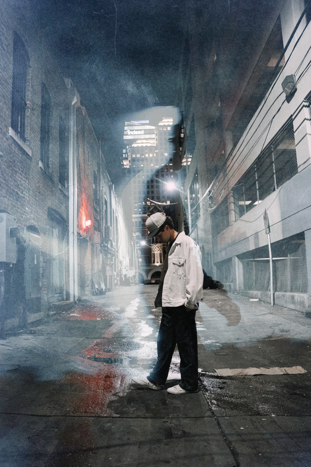 Hayden Summerall walking alone in nighttime city alley for Kaleidoscope single visuals