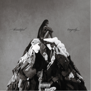 Ebony Riley Beautiful Tragedy album cover black and white portrait sitting on pile of clothing