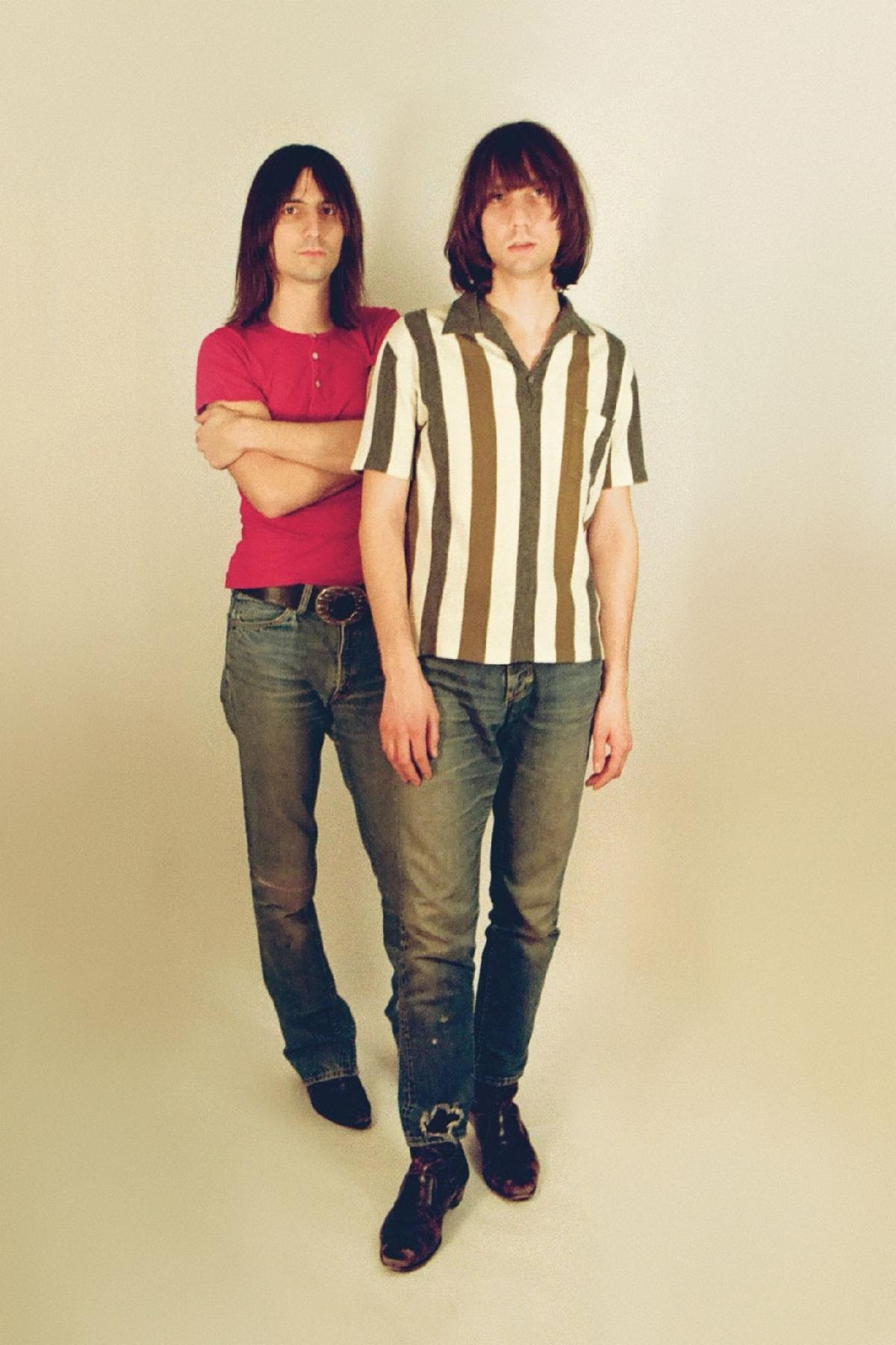The Lemon Twigs pose in vintage-inspired outfits against a cream studio backdrop ahead of the release of Look For Your Mind!