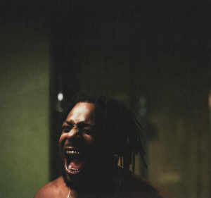 Isaiah Rashad intense close-up screaming Do I Look High music video scene