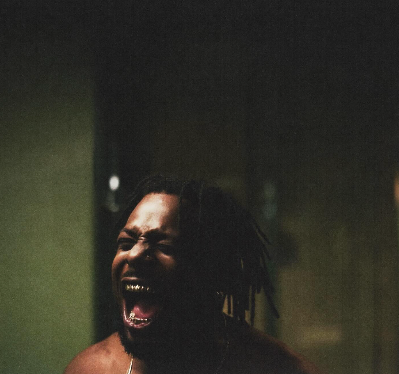 Isaiah Rashad intense close-up screaming Do I Look High music video scene