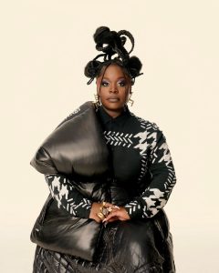 Portrait of Tank from Tank and the Bangas wearing sculptural black fashion ahead of The Last Balloon album release