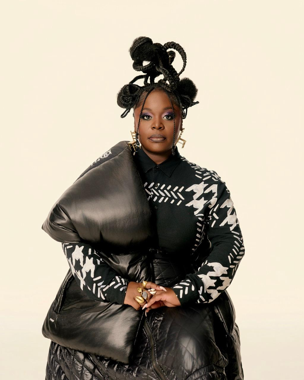 Portrait of Tank from Tank and the Bangas wearing sculptural black fashion ahead of The Last Balloon album release