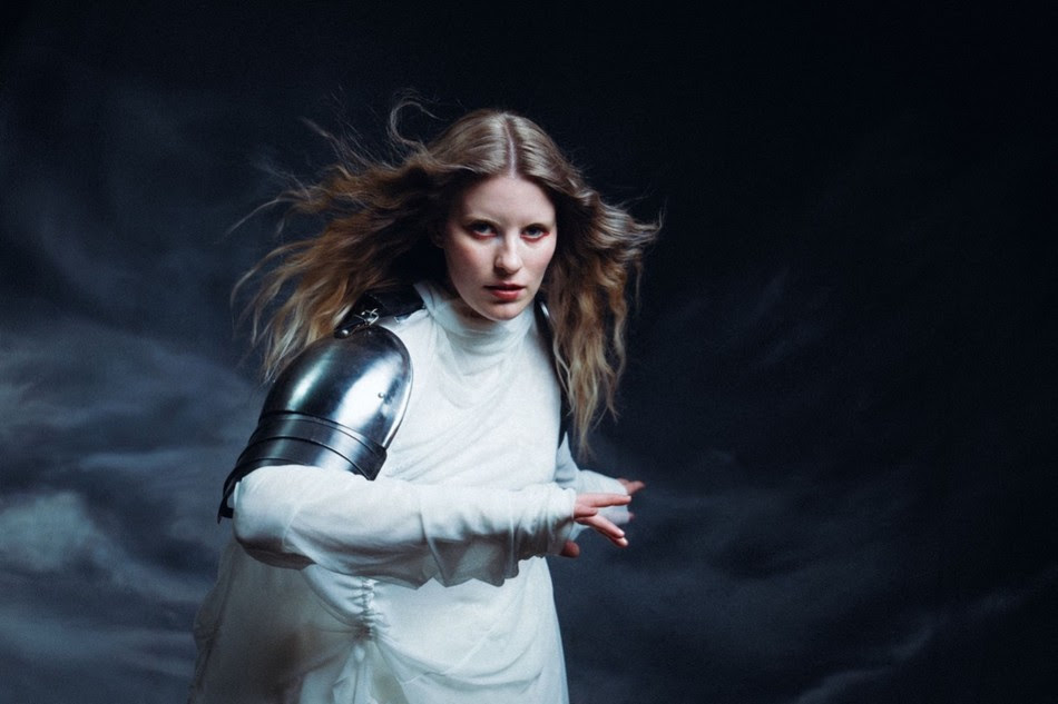 Paris Paloma poses in silver armor-inspired styling during promotional shoot for The Fatal Flaw