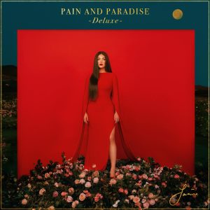 Janine Pain and Paradise Deluxe album cover featuring red dress and floral arrangement