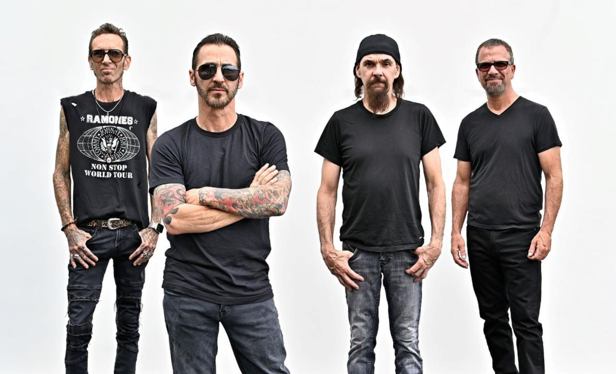 Godsmack band members standing together in black outfits press photo