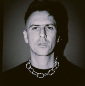 Boys Noize portrait by Jas Davis wearing chain necklace promoting new single Shut It Down featuring TAICHU