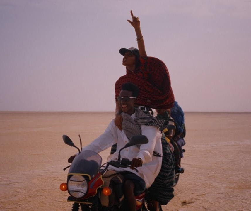 Motorcycle riders travel across Ethiopia's Afar region in a scene from Alewya's "Maktoub" music video