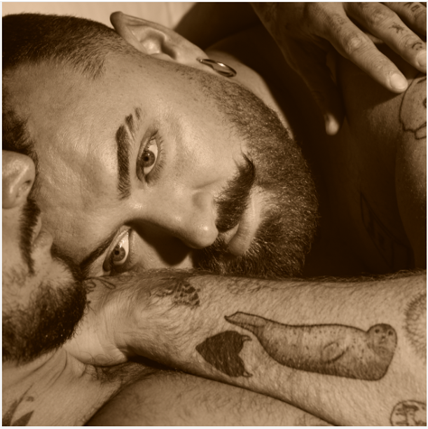 Close-up portrait of Sam Smith promoting the new single "My Guy" from the 2026 album Hazel Eyes.