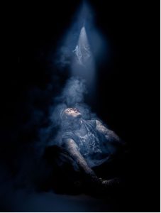 Ryan Oakes promotional portrait for Scary Stories After Dark under a dramatic spotlight