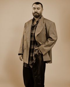Sam Smith poses in a studio portrait for their 2026 album Hazel Eyes and new single “Oh Mother.”