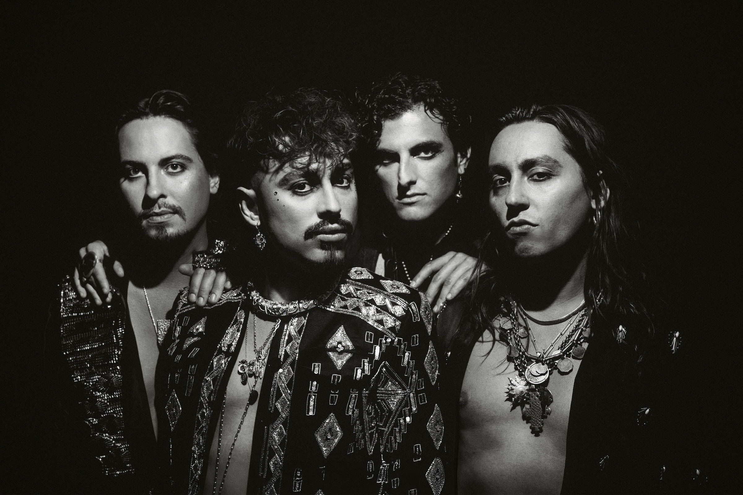 Greta Van Fleet pose for a black-and-white promotional portrait ahead of their intimate Chicago Metro performance and new single "Saw You Stand."
