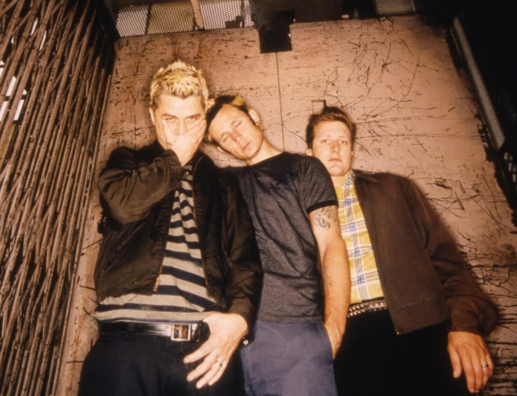 Green Day band members Billie Joe Armstrong, Mike Dirnt, and Tré Cool in a promotional photo for the Nimrods soundtrack.