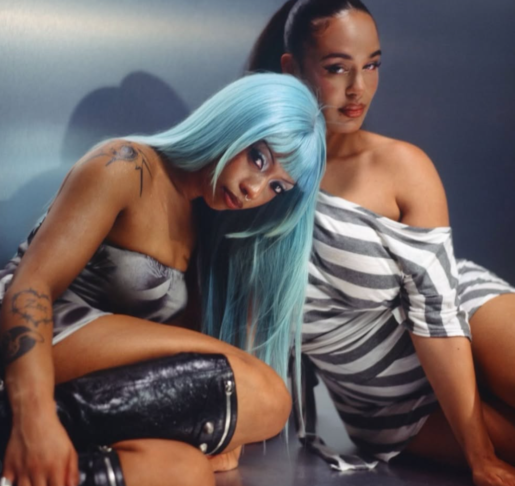 Nia Archives and Jorja Smith pose together in a promotional photo for their collaborative single "Get Me Down."