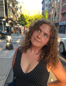 Indie folk singer-songwriter Annabelle Dinda photographed on a New York City street in 2026.
