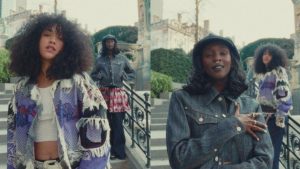 Jenevieve and Lous and The Yakuza appear in cinematic scenes from the official "Fleur-De-Lis" music video filmed in Brussels, Belgium.