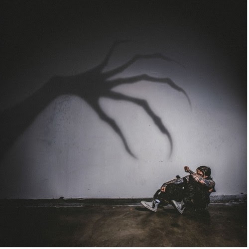 Ryan Oakes Scary Stories After Dark album artwork featuring a shadowy hand reaching toward the artist