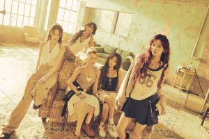 Members of i-dle pose in promotional photo for their ninth mini album We made.