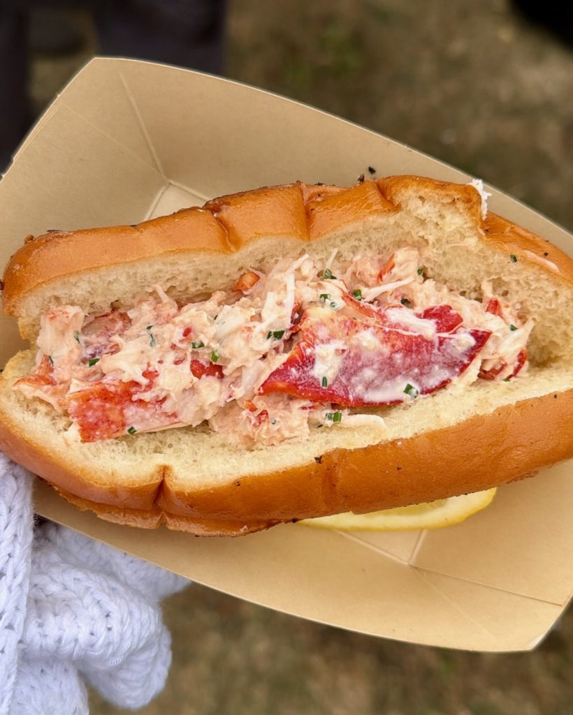 Arquet lobster roll with lobster, brown butter and chives on a toasted split-top bun at Outside Lands 2026.