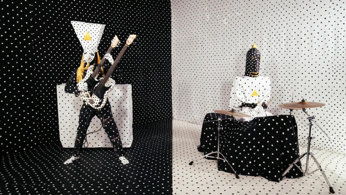 Angine de Poitrine perform with microtonal guitars and drums in their signature black-and-white polka-dot costumes