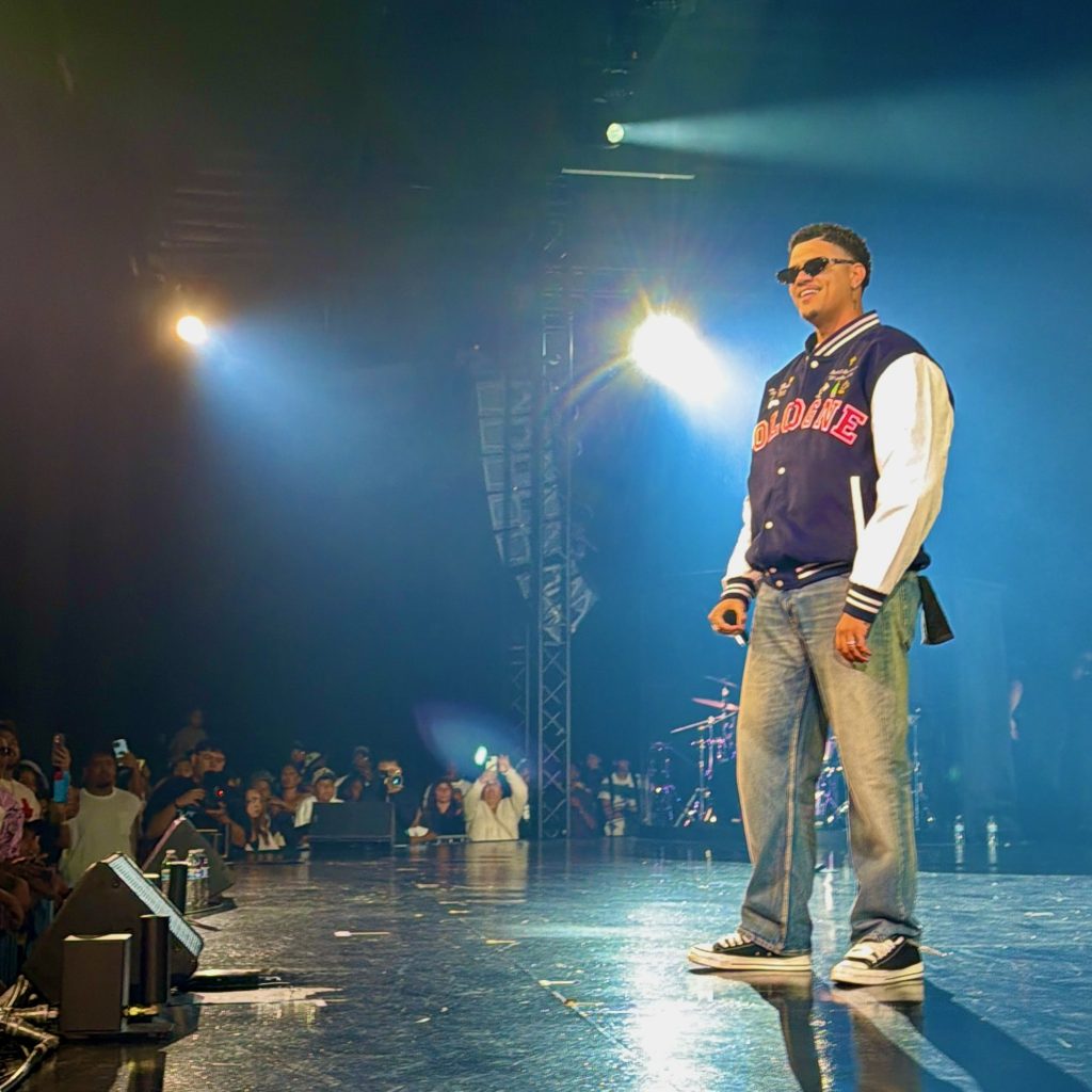 Tommy Zuko walks across the stage during his GLO Fest performance.
