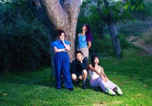 The Linda Lindas photographed outdoors for their 2026 album Gotta Get Out