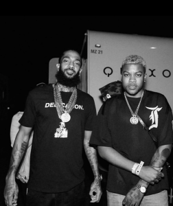 Nipsey Hussle and Bino Rideaux together in a black-and-white photograph.