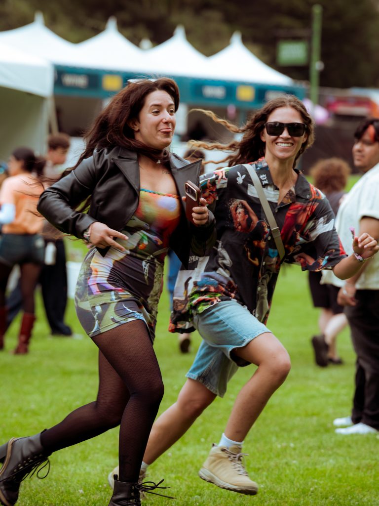Festivalgoers dancing on the grass at Outside Lands 2026 in San Francisco Title: Festivalgoers Dance at Outside Lands 2026