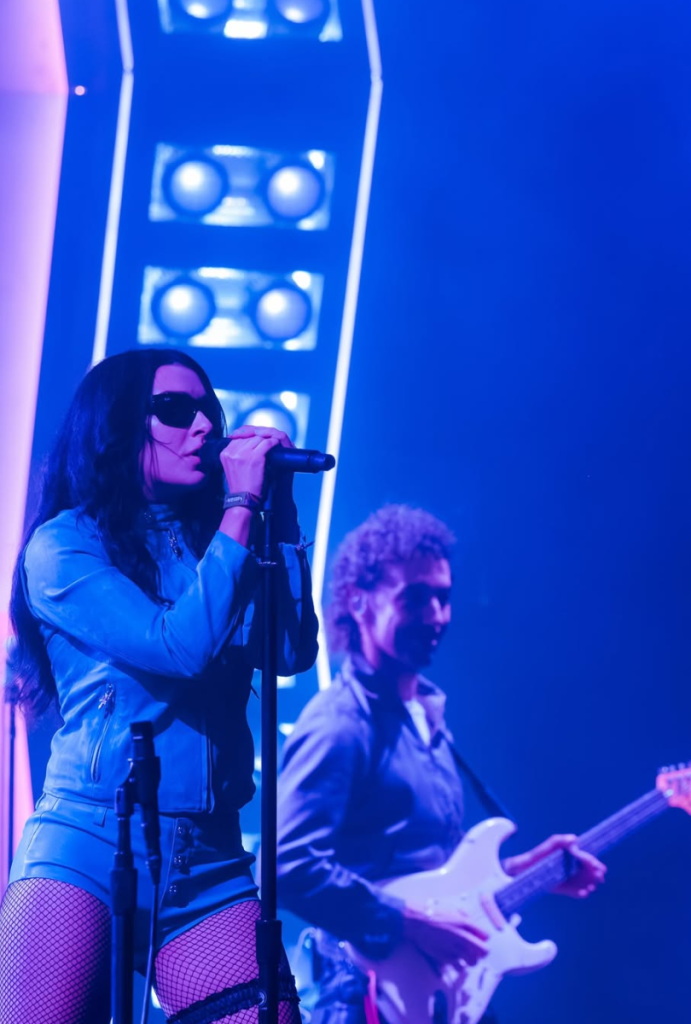 Charli XCX joins The Strokes onstage for a surprise appearance at Outside Lands 2026 in San Francisco.