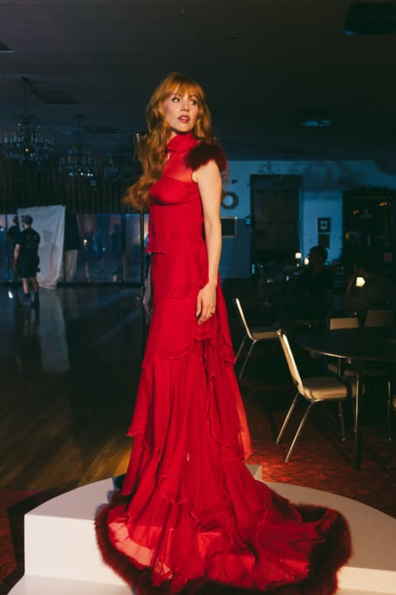 Carly Rae Jepsen in a red dress for her 2026 single “Motivation”