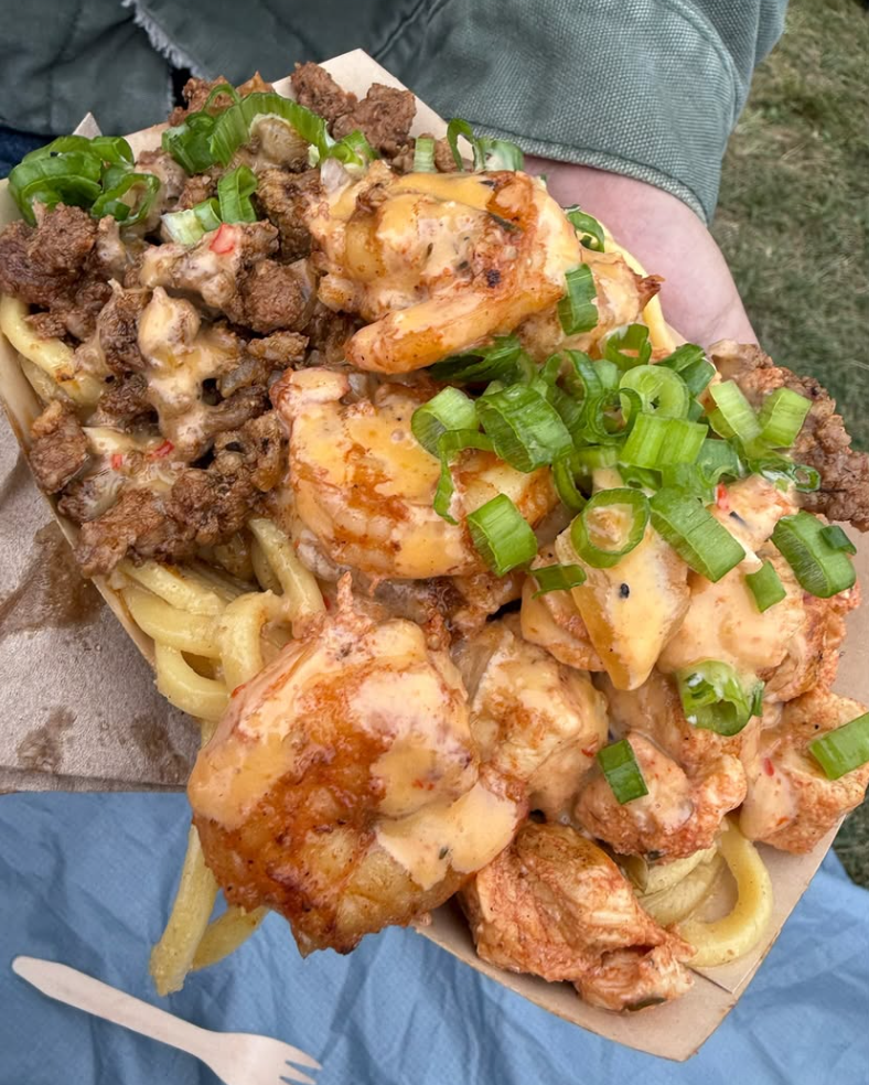 Chef Smelly’s garlic noodles topped with shrimp, meat, green onions and creamy sauce at Outside Lands 2026.
