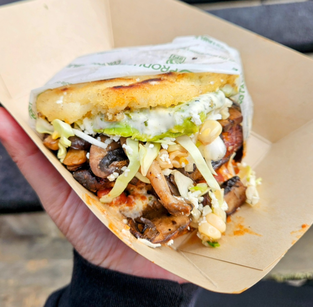 Mezcla Eats arepa filled with mushrooms, slaw, avocado and sauce at Outside Lands 2026 in San Francisco.