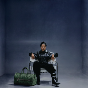 Jazzy seated in a chair for Peace & Patience promotional photo