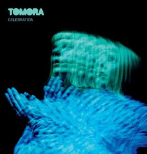 TOMORA CELEBRATION EP cover featuring a blue and turquoise multiple-exposure portrait of AURORA against a black background.